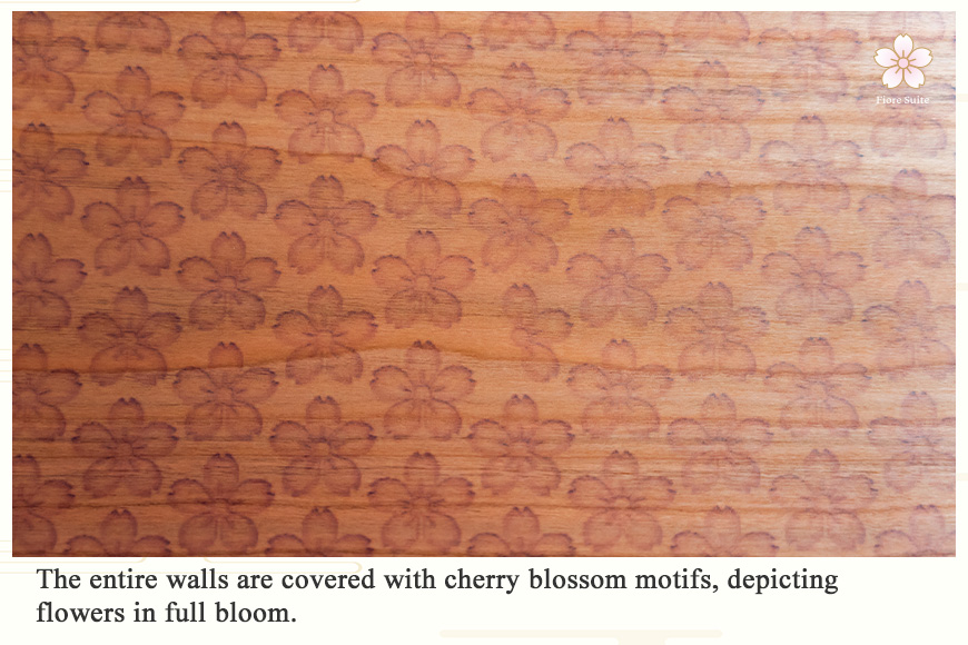 The entire walls are covered with cherry blossom motifs, depicting flowers in full bloom.